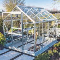 Metal framed greenhouse in winter garden