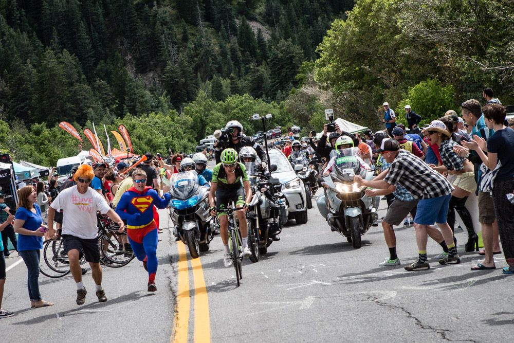 Joe Dombrowski (Cannondale) makes his way through fans on the way to the win.