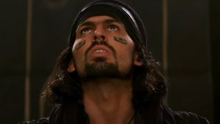 Oded Fehr looks up with concern in The Mummy.