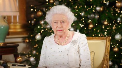 london, united kingdom in this undated image supplied by sky news, queen elizabeth ii sits at a desk in the 1844 room at buckingham palace, as she records her christmas day broadcast to the commonwealth at buckingham palace, london photo by sky news via getty images