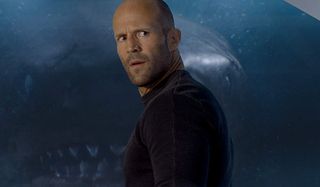 The Meg Jonas looks back in disbelief, as the image of the Megalodon is projected in front of him