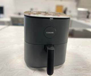 The Cosori Pro LE Air Fryer on a kitchen counter.