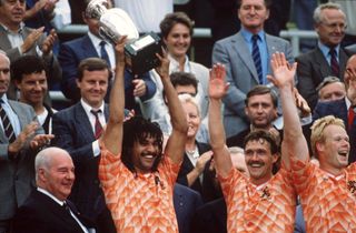 Ruud Gullit lifts the European Championship trophy after the Netherlands' win over the Soviet Union in the final of Euro 88.