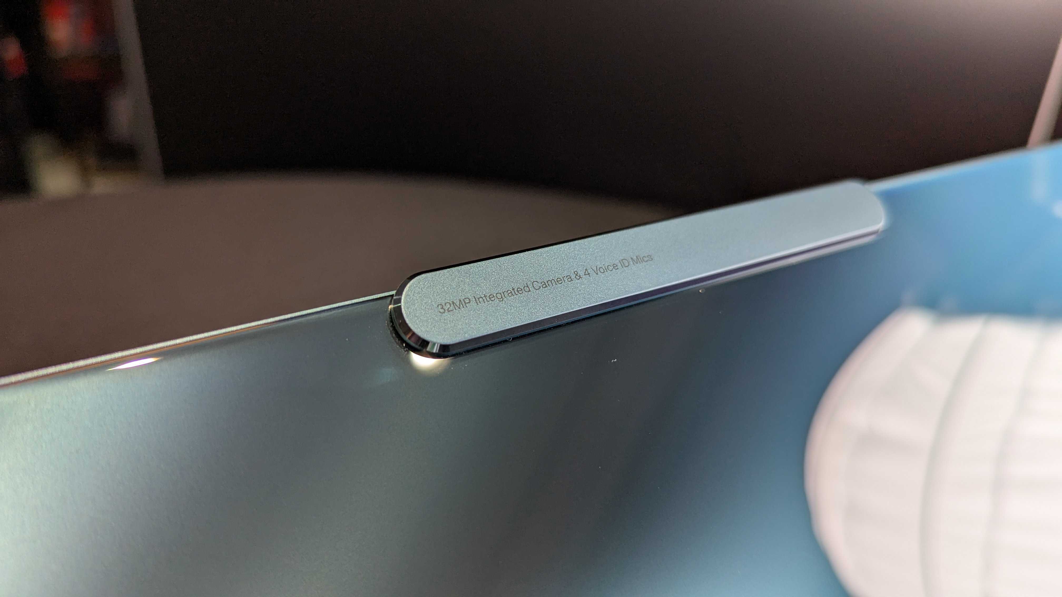 A close-up of the Lenovo Yoga Slim 9i 14 (Gen 10)'s "Communications Bar," housing the camera and microphones.