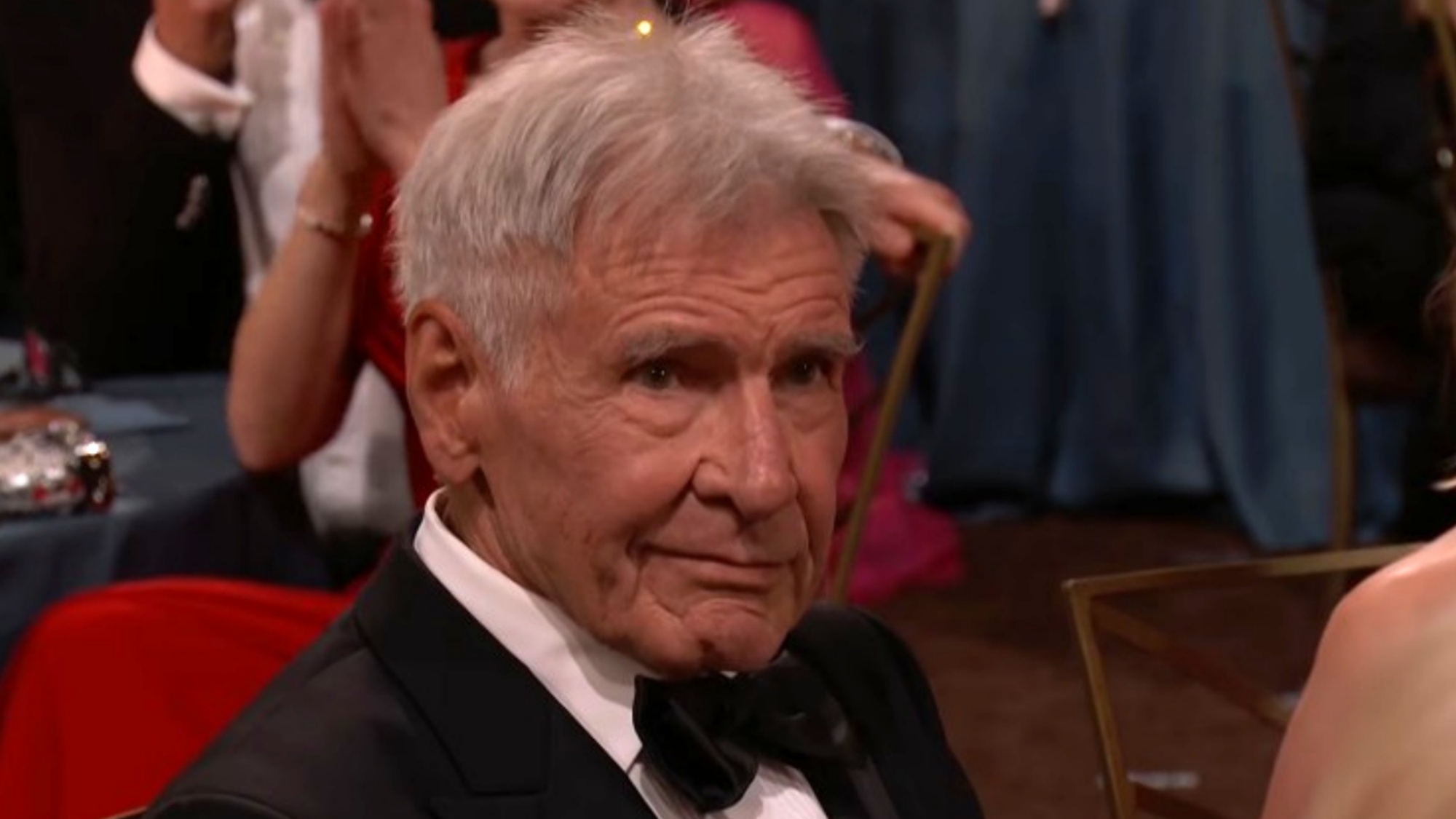 A screenshot of Harrison Ford sitting at his table at the Emmy Awards.