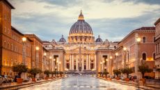 St. Peter's Basilica in the evening from Via della Conciliazione in Rome.