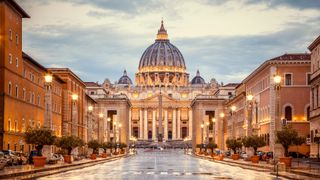 St. Peter's Basilica in the evening from Via della Conciliazione in Rome.