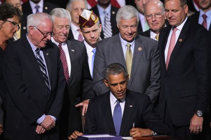 Obama signs the Veterans Choice Act