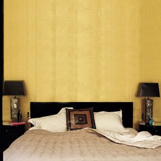 bedroom with yellow wall and bed