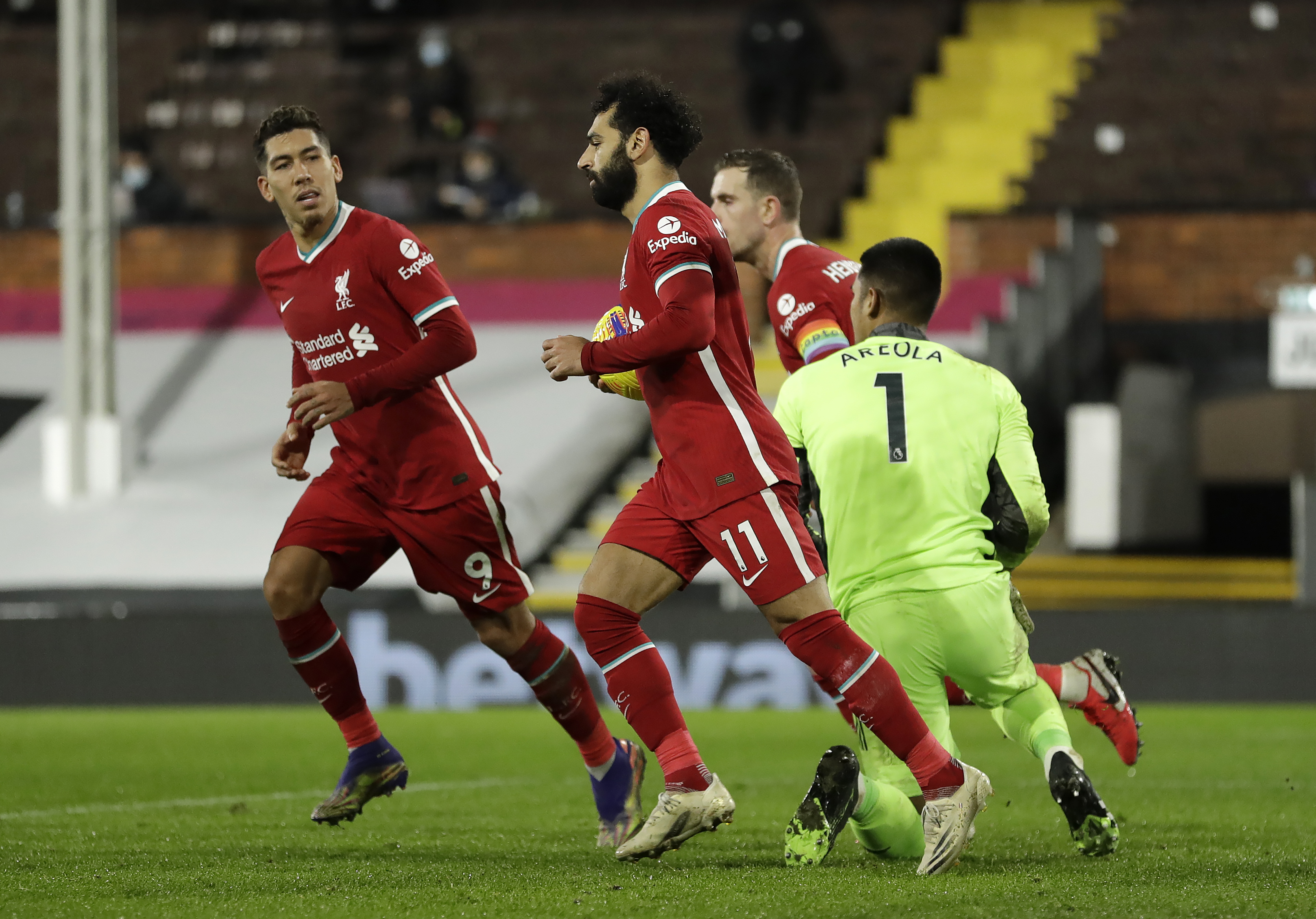 Mohamed Salah wheels away in celebration after his successful spot-kick