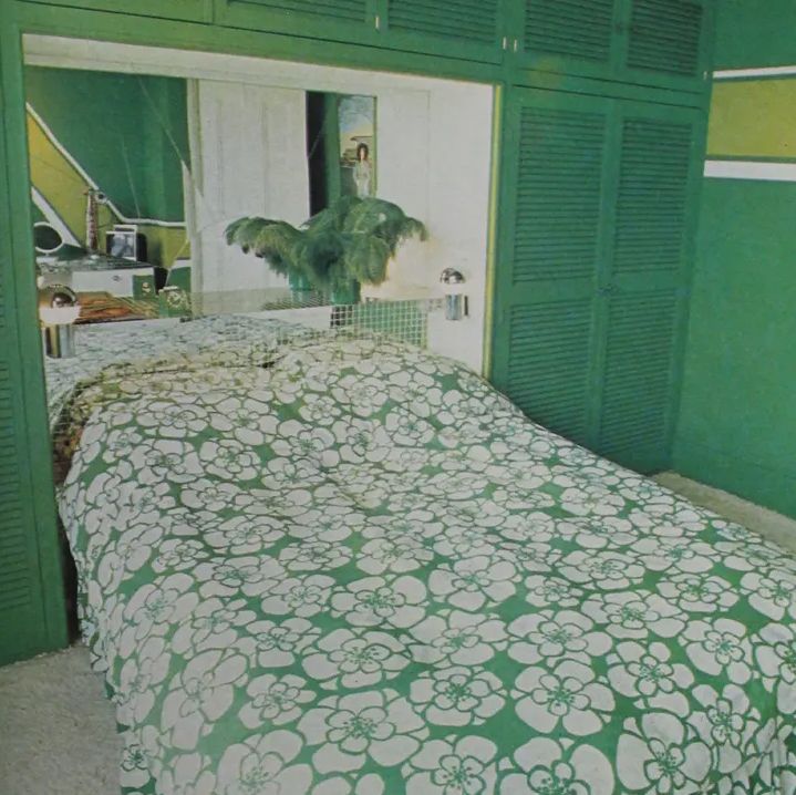 Archive image from Ideal Home magazine of green bedroom