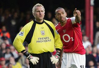 Thierry Henry of Arsenal explains the offside to Antti Niemi of Southampton during the Barclays Premiership match between Arsenal and Southampton at Highbury on October 30, 2004 in London.