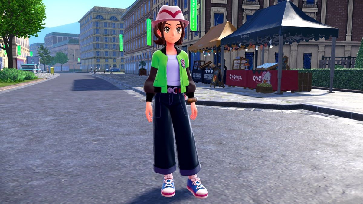 the female protagonist in pokemon legends z-a standing in a city street. she&#039;s wearing wide-legged pants, a series first