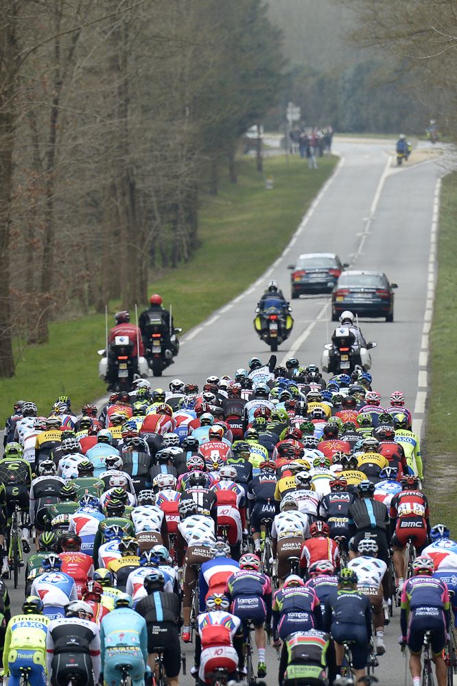 The pack rides during the first stage of the 73rd edition of the Paris-Nice.