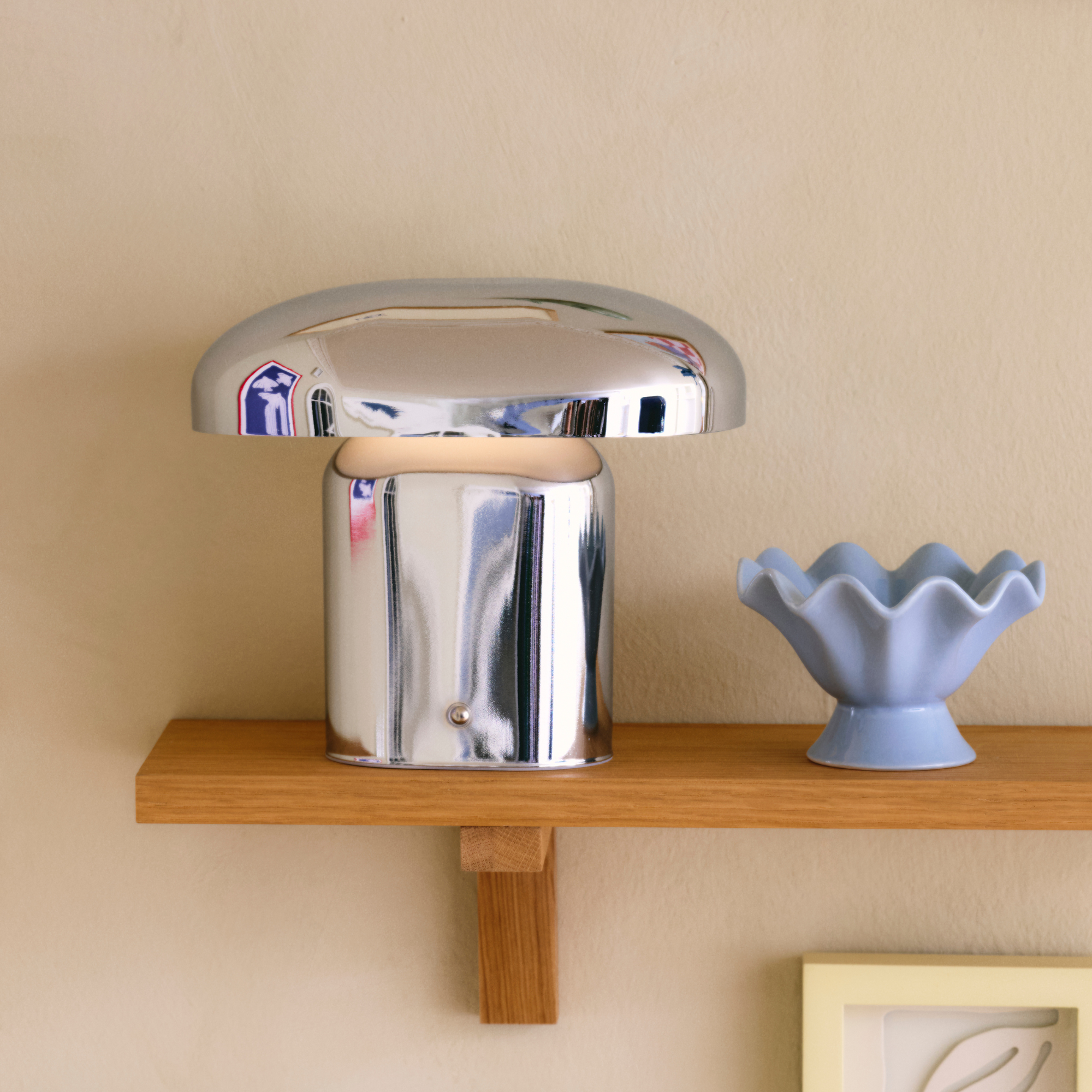 S&amp;oslash;strene Grene chrome table lamp on shelf.