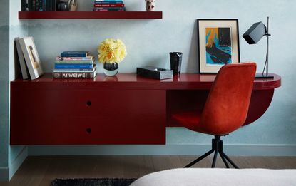 a red built in curved desk