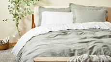 Coyuchi Organic Relaxed Linen Sheet Set on a bed against a white wall. 