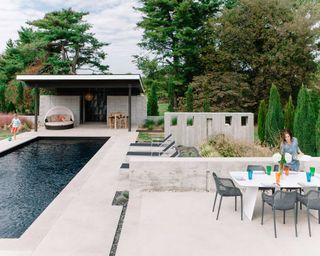 industrial style backyard with swimming pool and cover