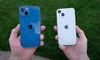 white iPhone 14 dummy alongside blue iPhone 13