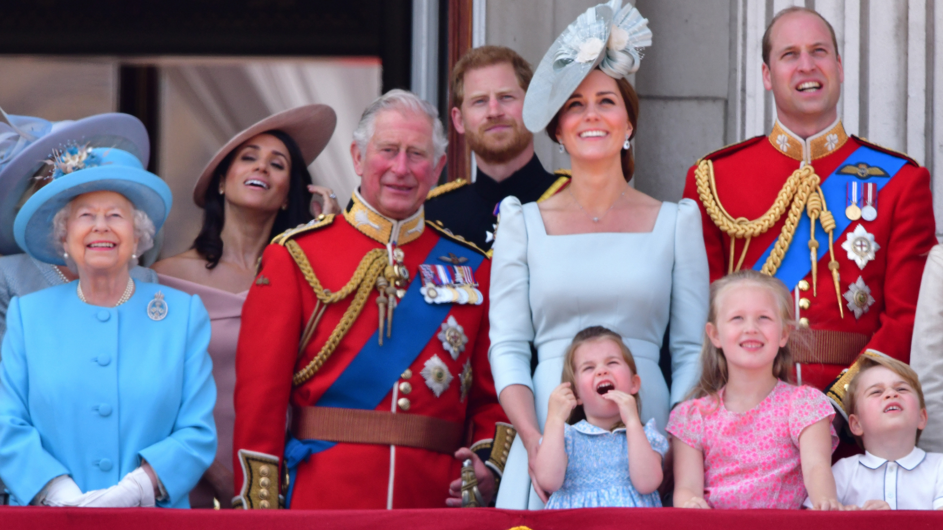 Queen Elizabeth II, Meghan, Duchess of Sussex, Prince Charles, Prince of Wales, Prince Harry, Duke of Sussex, Catherine, Duchess of Cambridge, Prince William, Duke of Cambridge, Princess Charlotte of Cambridge, Savannah Phillips, Prince George of Cambridge and Isla Phillips stand on the balcony of Buckingham Palace during the Trooping the Colour parade on June 9, 2018 