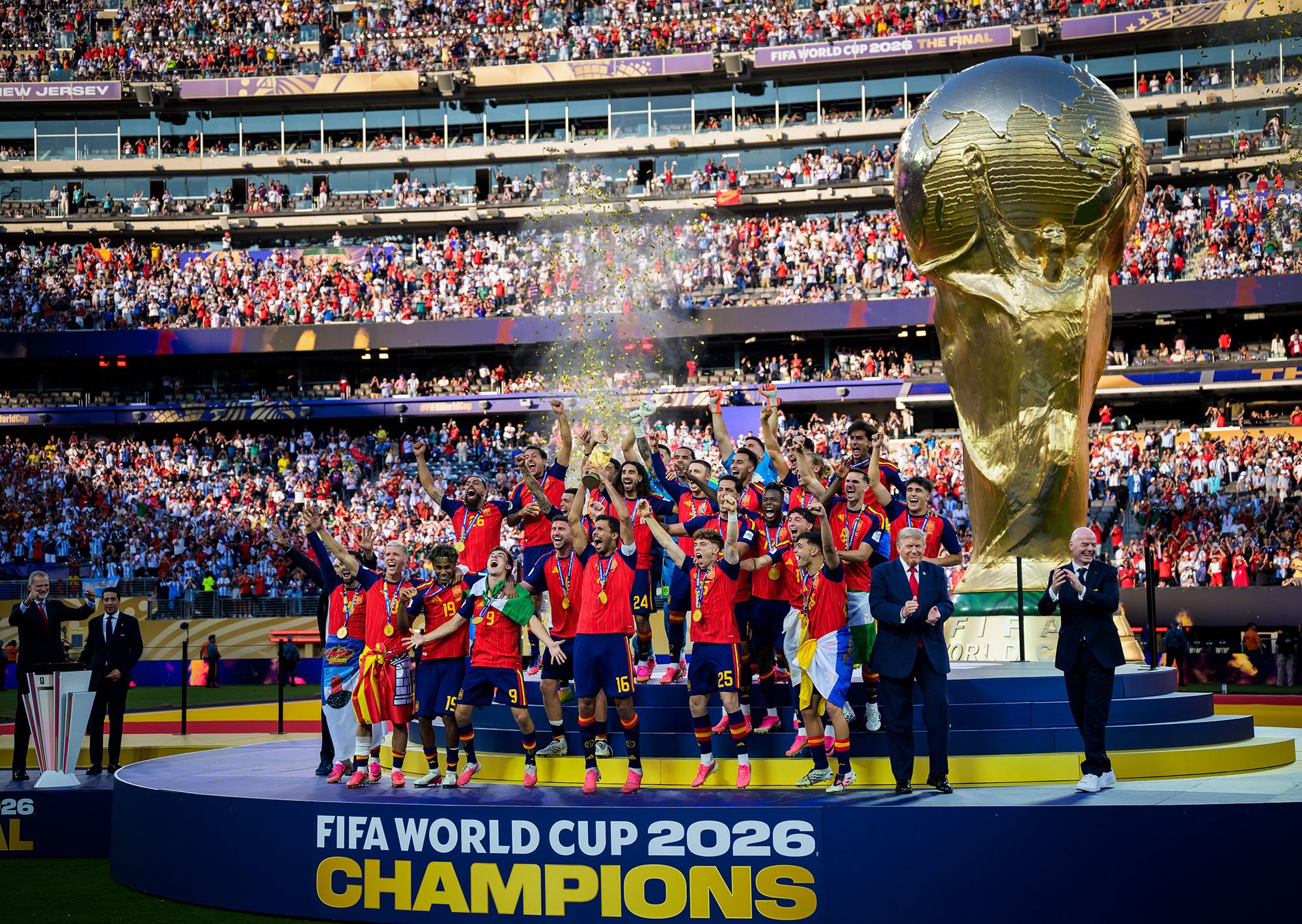 Joel Marklund photograph of the World Cup 2026 showing Spain lifting the World Cup trophy with Donald Trump and Gianni Infantino applauding