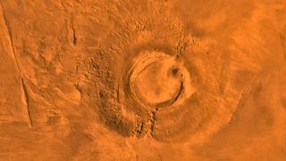 This digital-image mosaic of Mars' Tharsis plateau shows the extinct volcano Arsia Mons. It was assembled from images that the Viking 1 Orbiter took during its 1976 to 1980 working life at Mars.