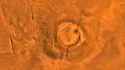This digital-image mosaic of Mars' Tharsis plateau shows the extinct volcano Arsia Mons. It was assembled from images that the Viking 1 Orbiter took during its 1976 to 1980 working life at Mars.