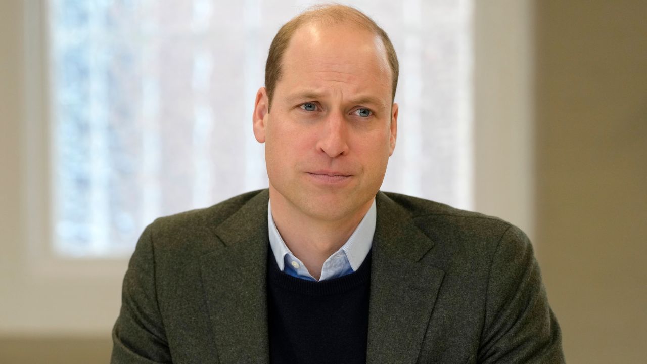 Prince William, Prince of Wales listens to members of staff as he visits Depaul UK in January 2023