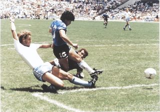 Diego Maradona scores for Argentina against England at the 1986 World Cup.