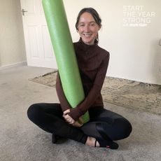 Katie Sims trying at home Reformer Pilates with a foam roller