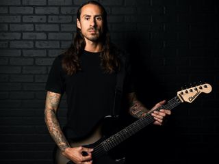 Phil Sgrosso holds his new Charvel signature guitar