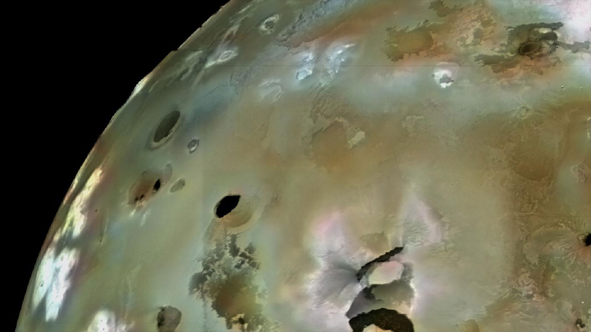 a spacecraft's image of volcanos on a distant moon