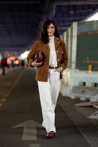 woman wearing sweater, buttoned jacket, pants, and loafer