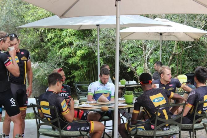 The riders relax with a coffee.