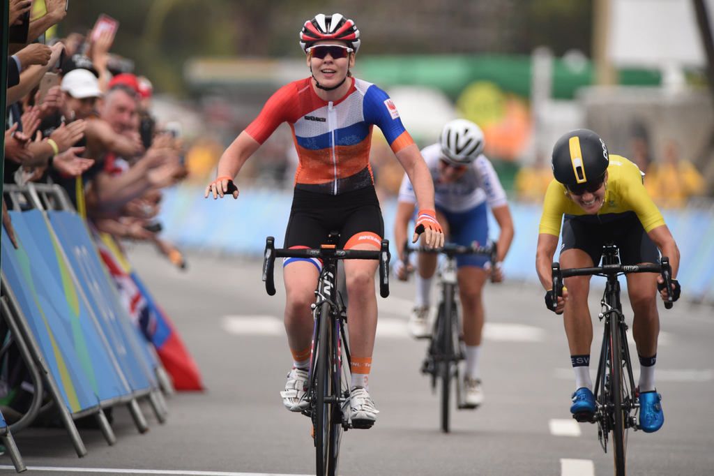 Anna van der Breggen starts to celebrate after beating Emma Johansson in the sprint with Elisa Longo Borghini claiming third