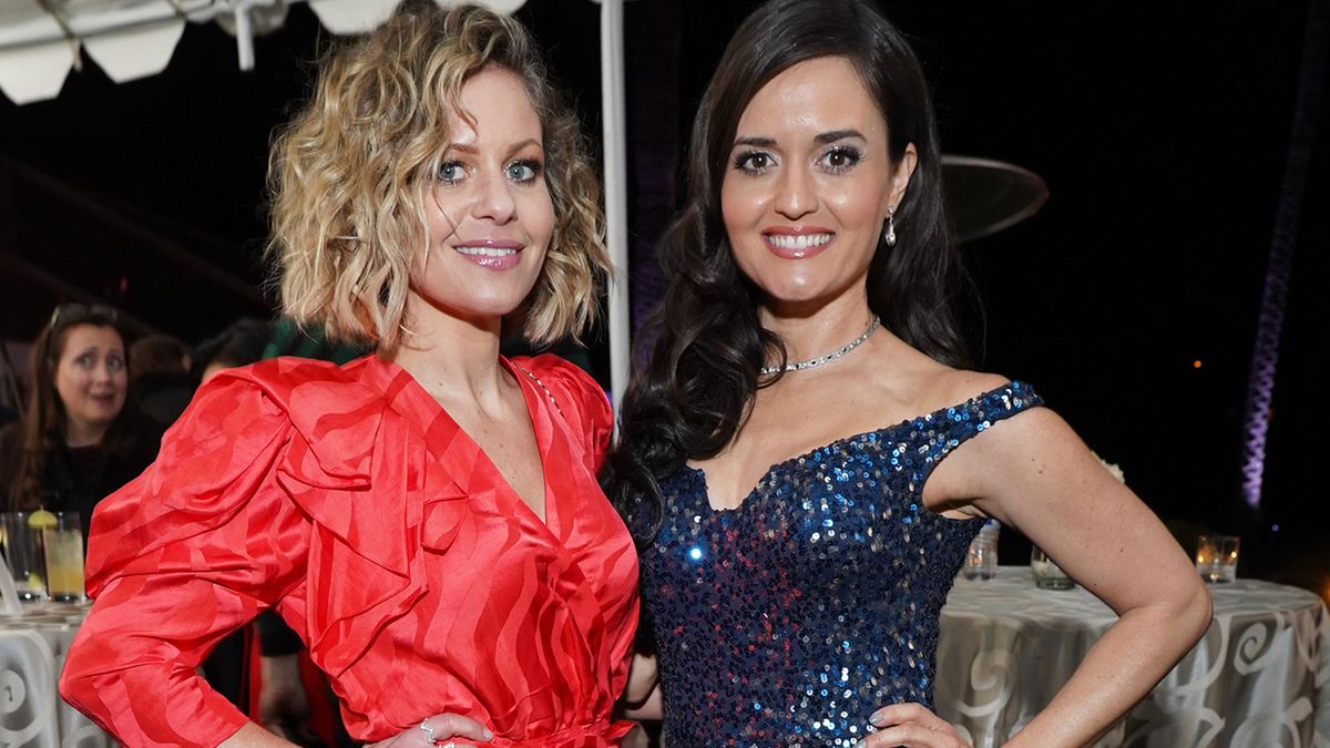 Candace Cameron Bure and Danica McKellar reunite in blue and red dresses at the TCA press tour.