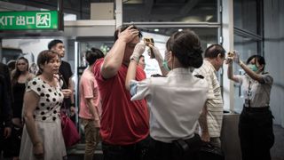 Passengers have their temperature checked at Hong Kong international airport in 2015 as part of preventive measures against the spread of Middle East respiratory syndrome (MERS).