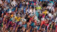 An ICM and multiple exposure of cyclists rounding a corner 