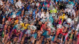 An ICM and multiple exposure of cyclists rounding a corner 