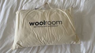 Woolroom Natural Latex Washable Wool Pillow in its carry bag