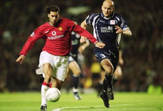 Manchester United's Ruud van Nistelrooy is challenged by Lille's Pascal Cygan in a Champions League clash in September 2001.