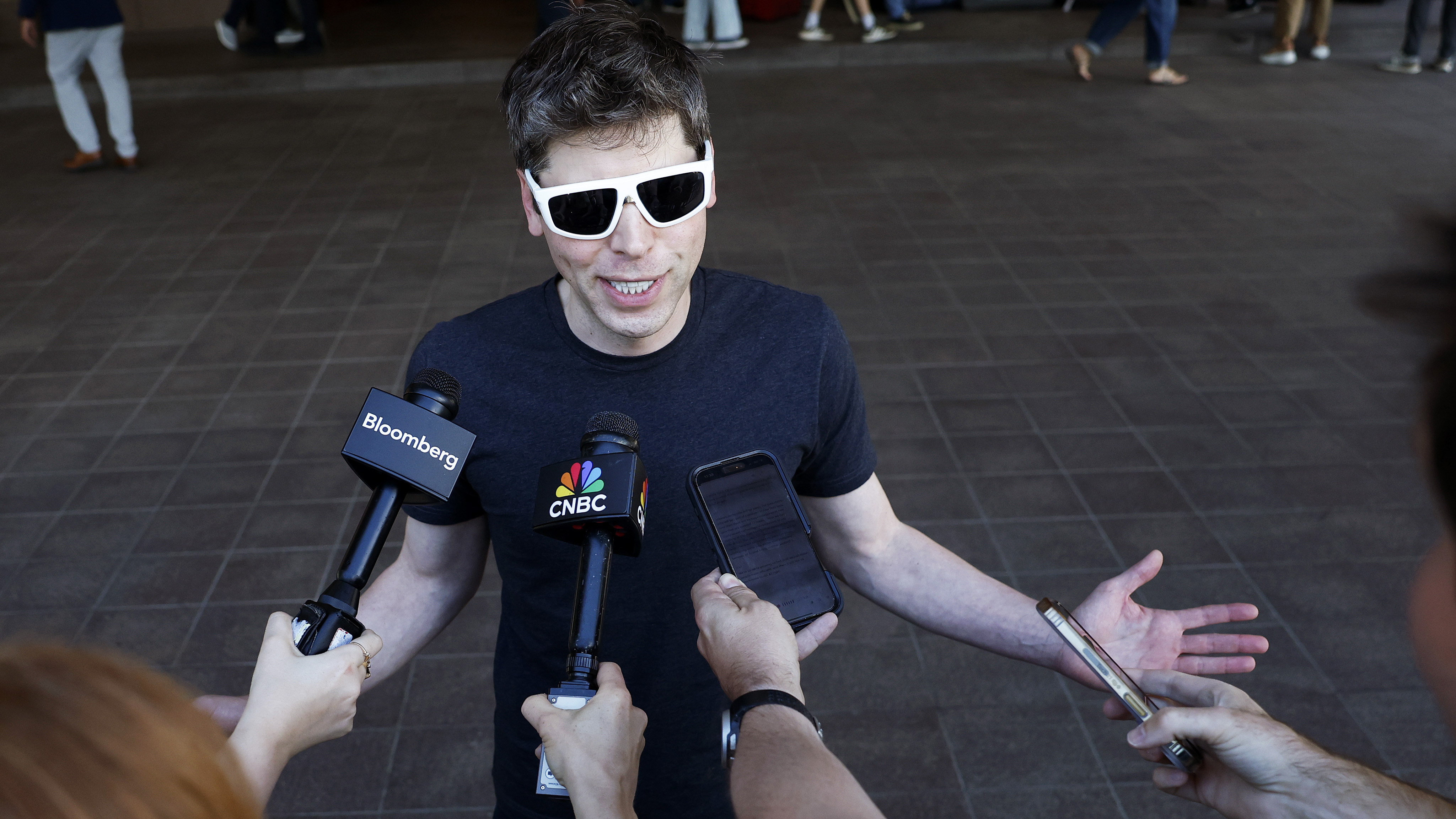 SUN VALLEY, IDAHO - JULY 08: CEO of OpenAI Sam Altman speaks to members of the media as he arrives at the Sun Valley lodge for the Allen & Company Sun Valley Conference on July 8, 2025 in Sun Valley, Idaho. Every year, some of the world's wealthiest and most powerful figures from the media, finance, technology, and political spheres converge at the Sun Valley Resort for the exclusive week-long conference hosted by boutique investment bank Allen & Co.
