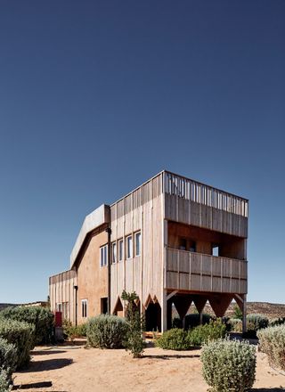 Gun Architects house made of mud and wood