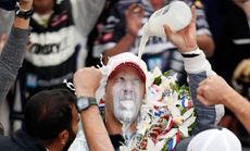 Tony Kanaan of Brazil pours the victory milk over his head after winning the Indy 500. 