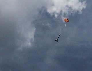 A Model Rocket Parachutes Safely to the Ground.