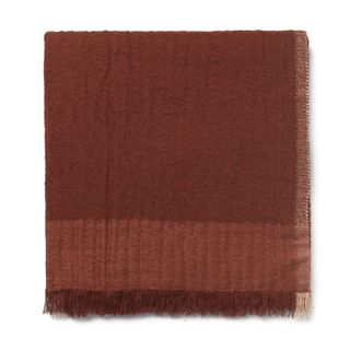 A rust red throw