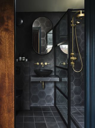 Shower room with black tiles from Bert and May Thornely home