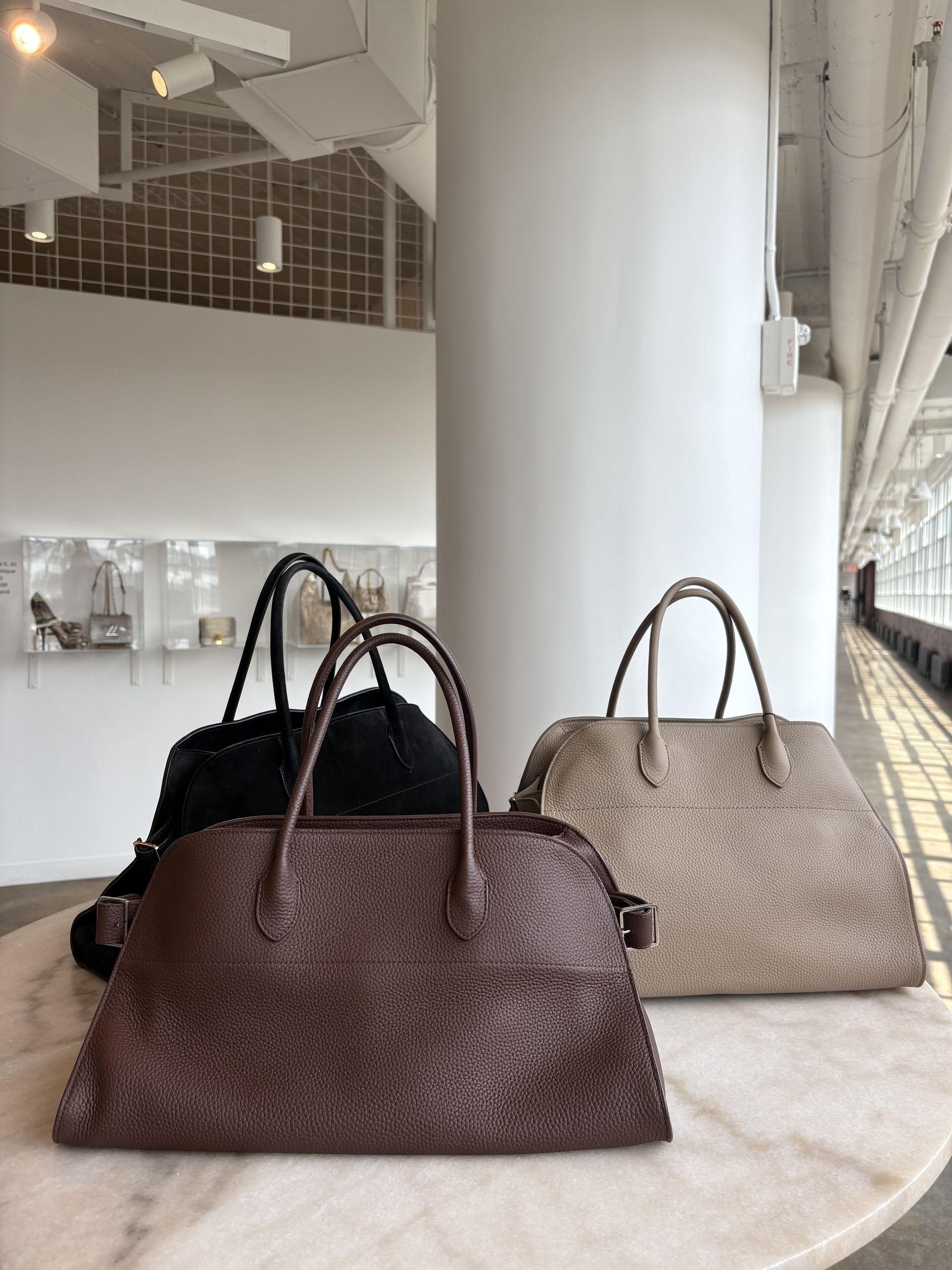 The Row Margaux 15, Margaux 17, and Margaux EW bags.