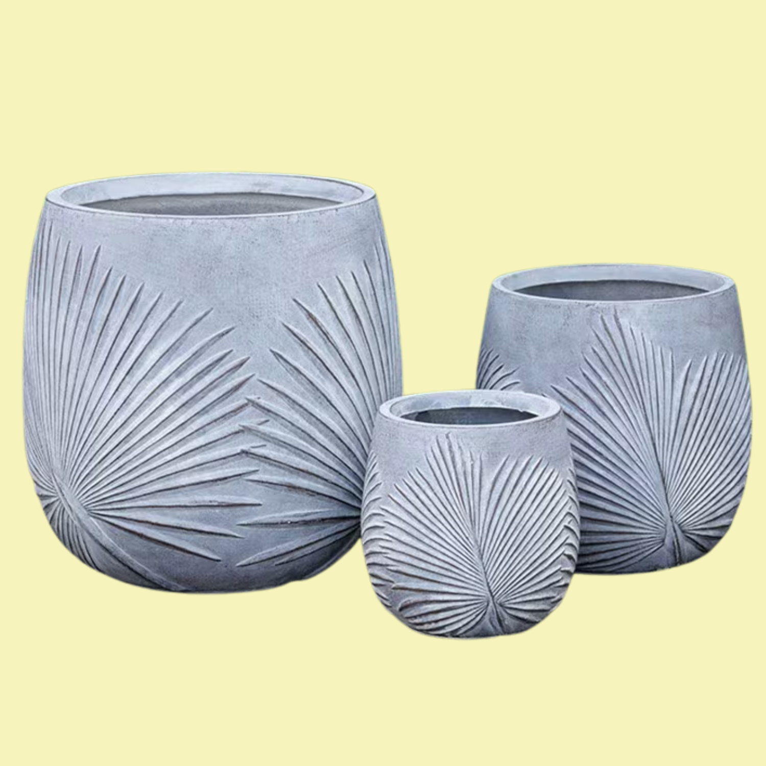 A set of three gray planters with a leaf design