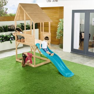 garden with wooden playhouse and childrens